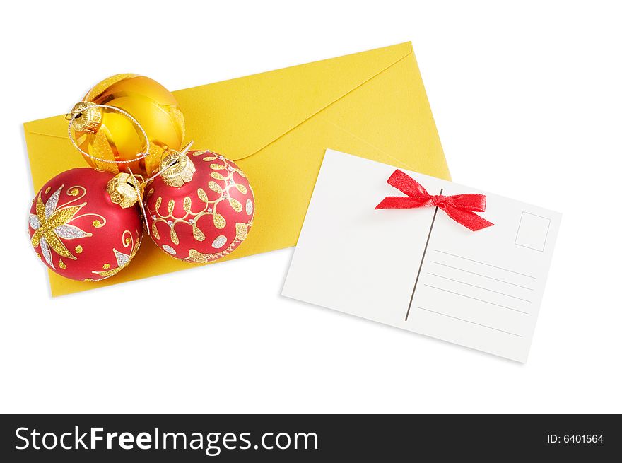 Postcard and christmas balls isolated on white background