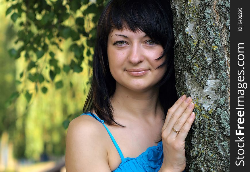 Young Woman Near Birch Tree In Summer. Young Woman Near Birch Tree In Summer