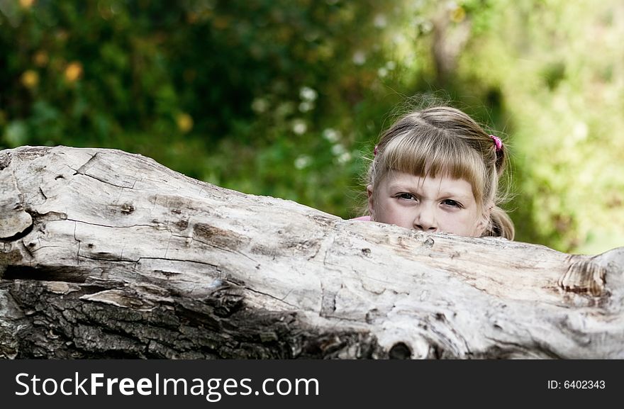 An image of little girl playing outdoor. An image of little girl playing outdoor