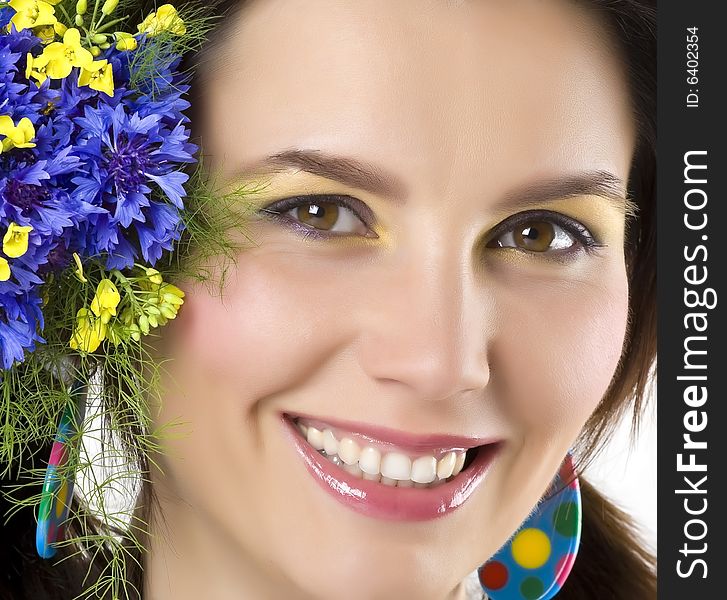 Happy young smiling woman with flowers. Happy young smiling woman with flowers