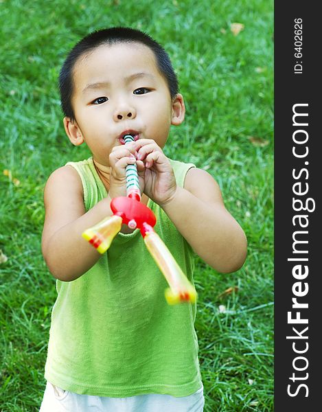 Baby Playing On Lawn