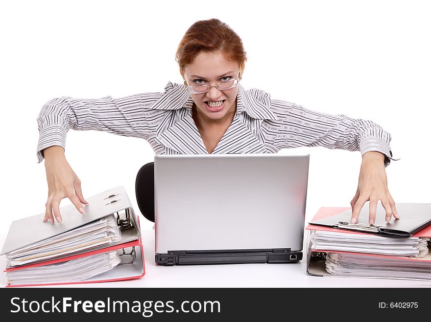 Aggravated young business lady at a table with laptop