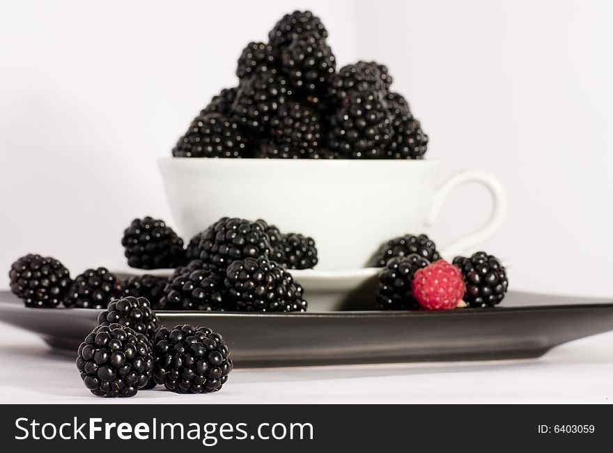 Macro view of fresh ripe blackberries in the bowl. Macro view of fresh ripe blackberries in the bowl