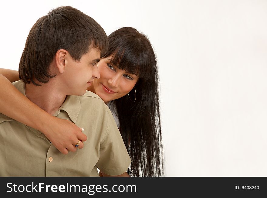Embraces of happy pair on a white background. Embraces of happy pair on a white background