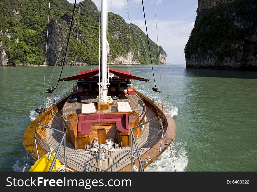 Beautiful wooden yacht sailing on the ocean. Beautiful wooden yacht sailing on the ocean