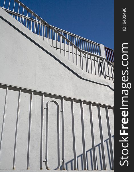 Grey ascending stairs and railing