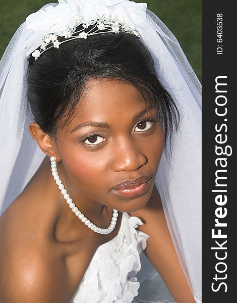 Beautiful African bride dressed in a white gown. Beautiful African bride dressed in a white gown