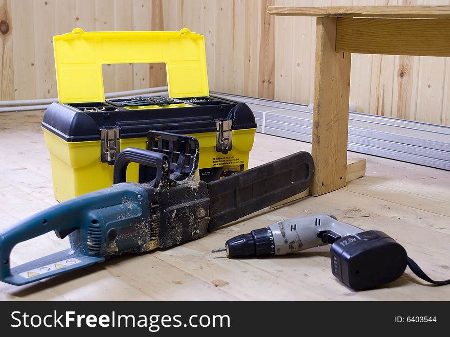 Tool box with a power saw and a turn-screw. Tool box with a power saw and a turn-screw