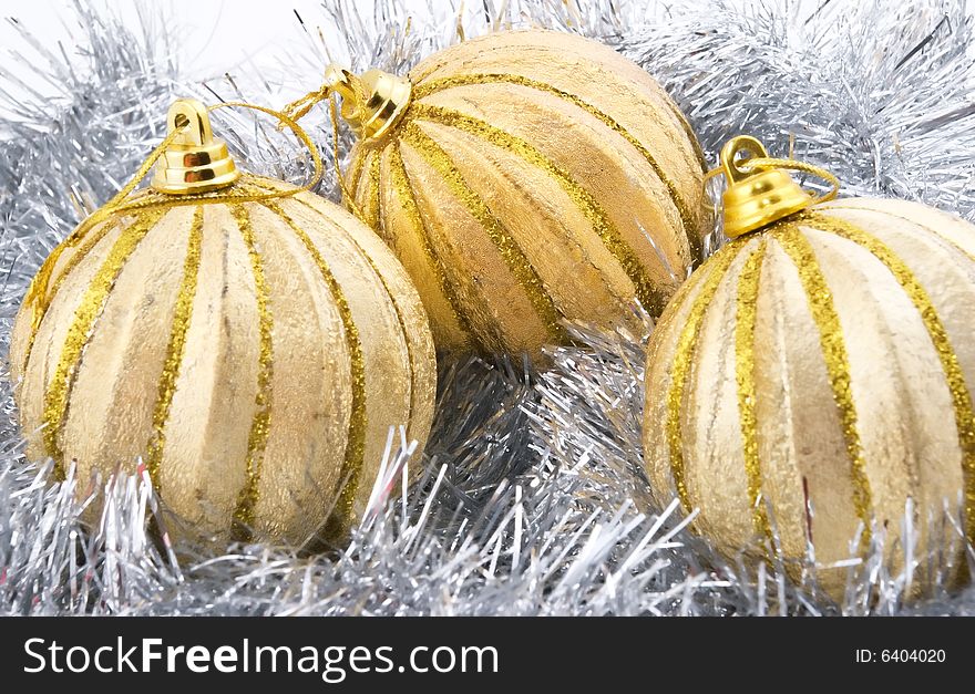 Three christmas balls decorated with tinsel isolated on white. Three christmas balls decorated with tinsel isolated on white