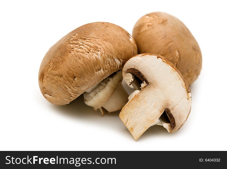 Slice brown champignon on white background