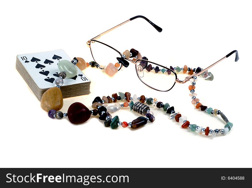 Cards, Nacklace and Glasses on white backgraund