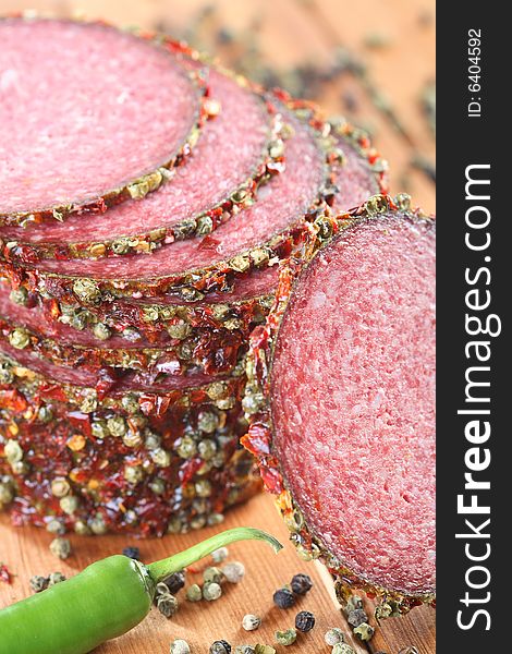 Tasty salami with pepper grains and chili. Tasty salami with pepper grains and chili