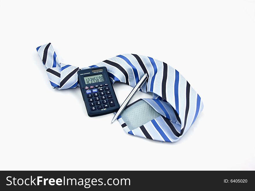 Calculator resting on a tie. Calculator resting on a tie