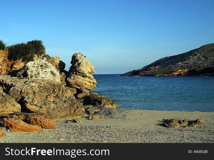 Rocks in a bay on a beach in Majorca in Spain