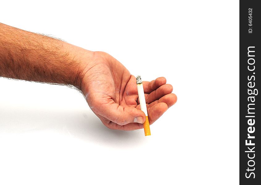 Shot of a hand holding a cigarette. Shot of a hand holding a cigarette