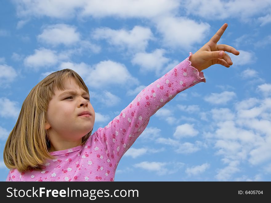 Girl pointing finger  with blue sky. Girl pointing finger  with blue sky