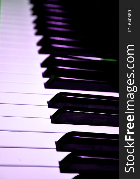 Closeup of piano keys with stage lighting reflecting. Closeup of piano keys with stage lighting reflecting.