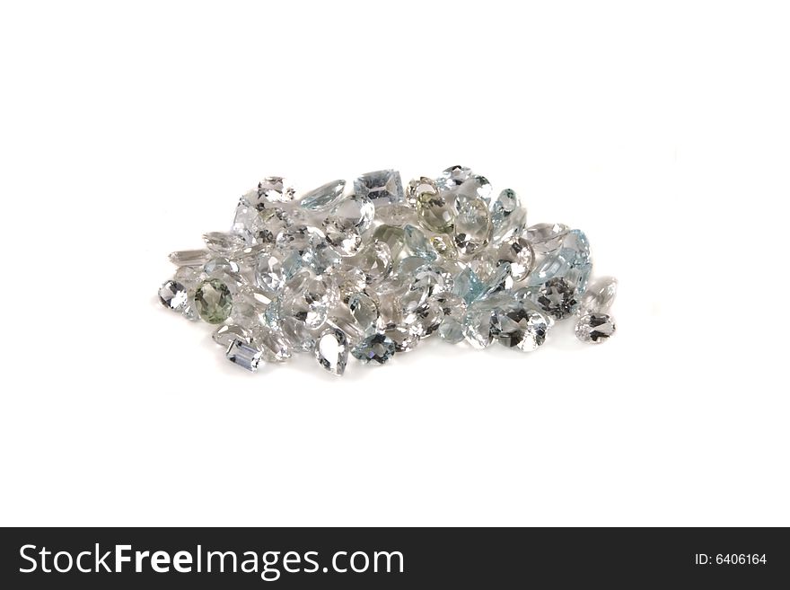 A group of mixed faceted white stones on a white background