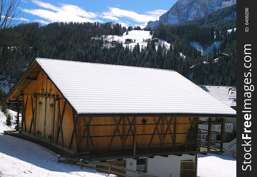 A beauiful shot of a mountain's cottage in Dolomiti