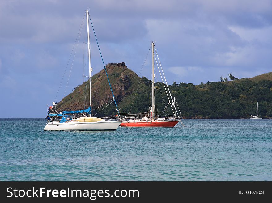 Small yachts anchored in small caribbean harbor. Small yachts anchored in small caribbean harbor