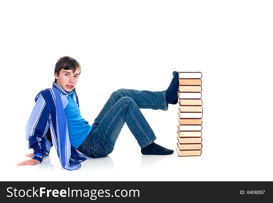 Teenager schoolboy with books on white background