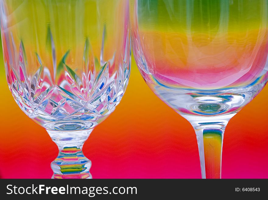 Wine glasses over a colorful background