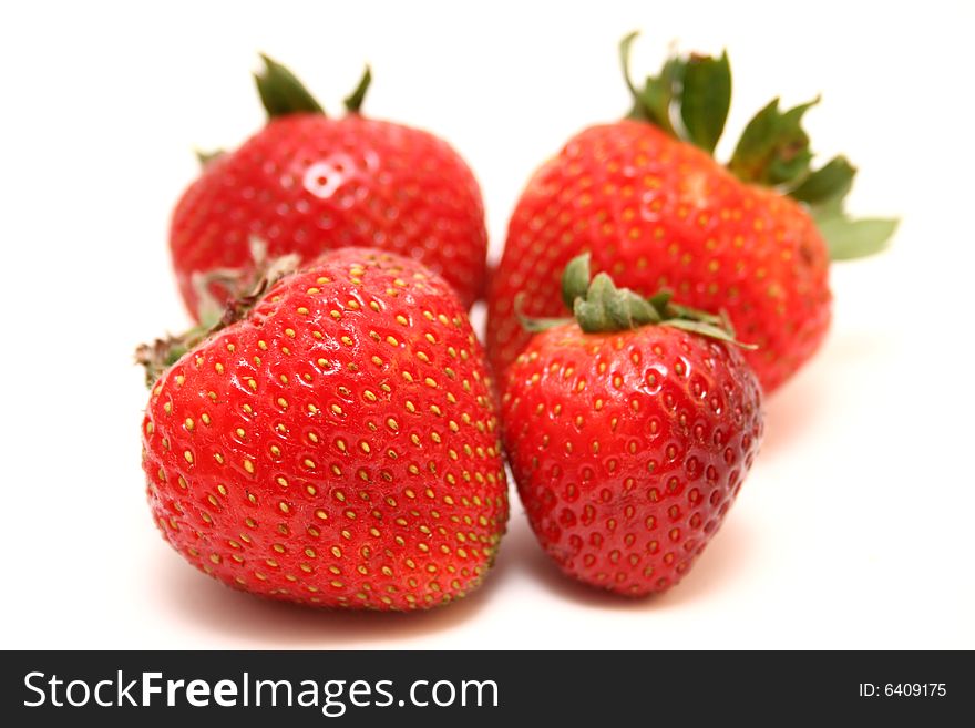 A group of strawberries isolated with a white background. A group of strawberries isolated with a white background.