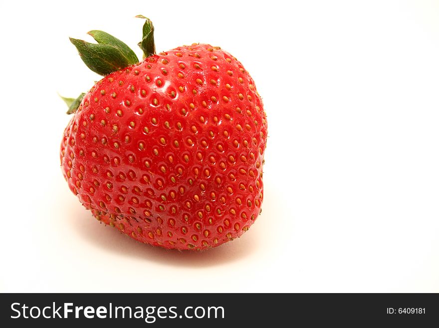 A strawberry isolated with a white background.