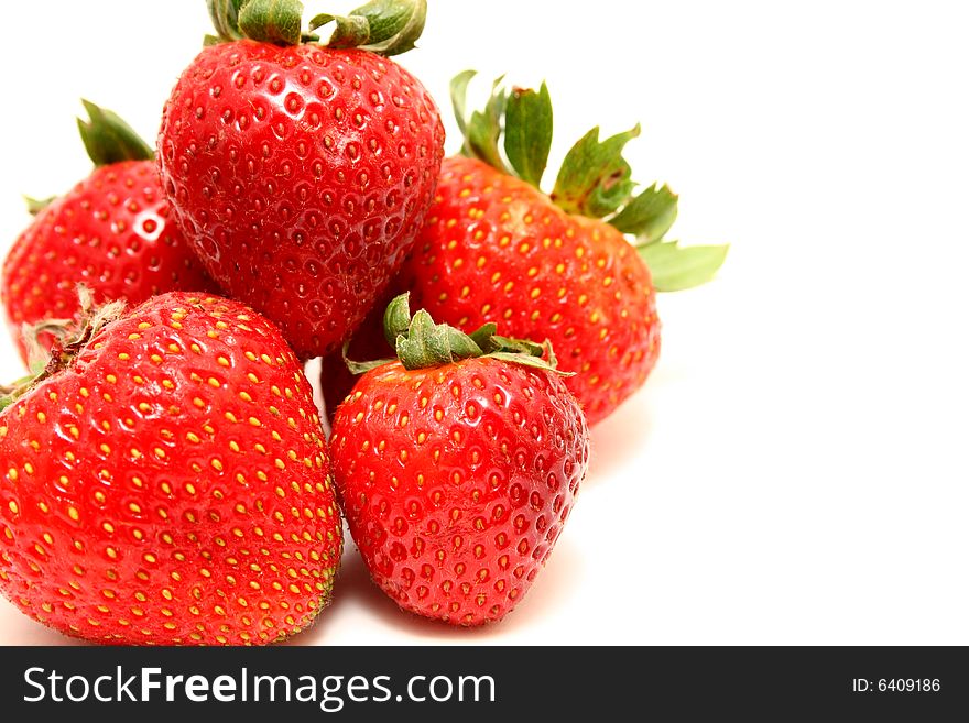 A group of strawberries isolated with a white background. A group of strawberries isolated with a white background.