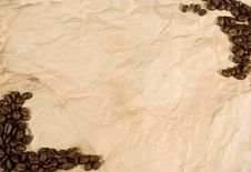 Coffee Beans On Old Crumpled Paper Royalty Free Stock Photography