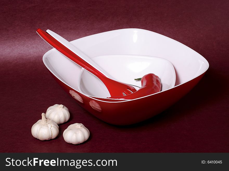 A composition with bowls, fork and garlic