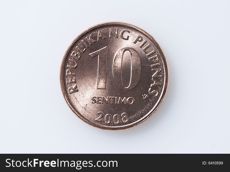 Ten-centavo Philippine coin on white background