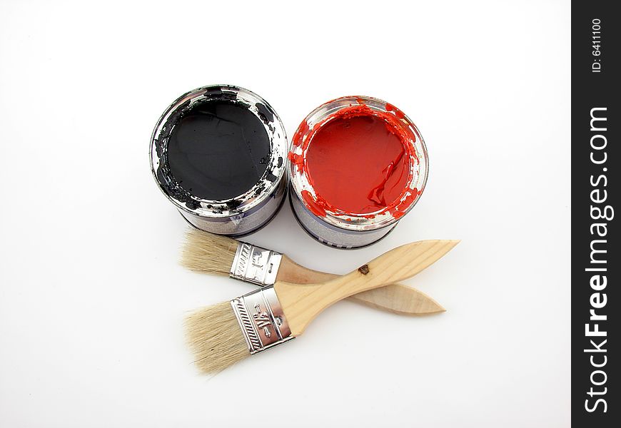 Paintbuckets and brushes isolated over white background, painting equipment.