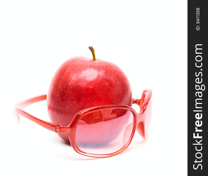 Red apple and red glasses isolated on white for your design