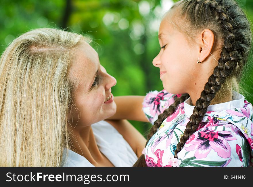 Mother and daughter looking at each other. Mother and daughter looking at each other.