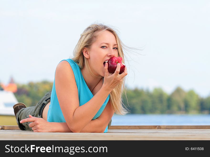 Girl Eating The Apple