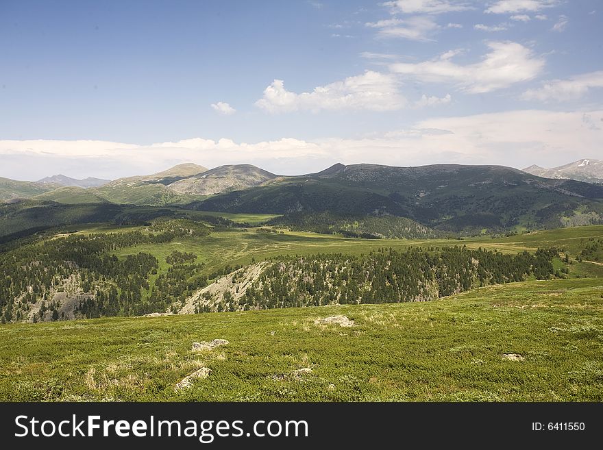 High mountain's summer view, Altai, blue sky, white clouds, lot of sun