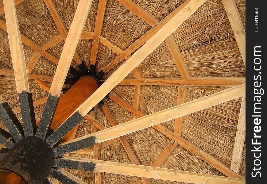 A view from the underside of a wooden sun shade umbrella in Sanya, China. A view from the underside of a wooden sun shade umbrella in Sanya, China.