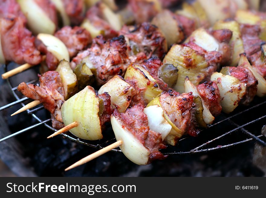 Sizzling barbecue sticks with meat and vegetables. Sizzling barbecue sticks with meat and vegetables