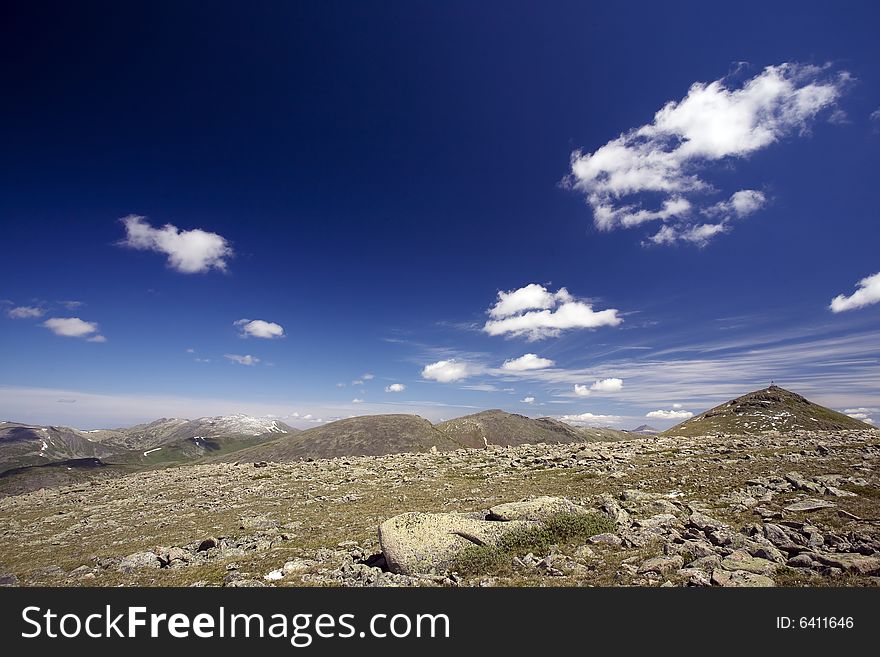 High mountain's rocks, summer, sky and clouds. High mountain's rocks, summer, sky and clouds