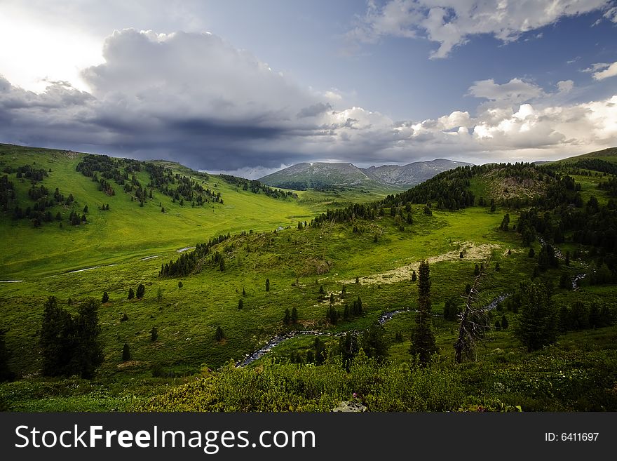 High mountain's summer view, Altai, blue sky, white clouds, lot of sun