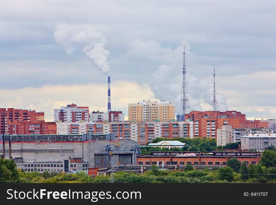 Urban scene with energy factory, construction factory and houses