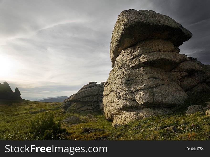 High mountain's rocks, summer, sky and clouds. High mountain's rocks, summer, sky and clouds