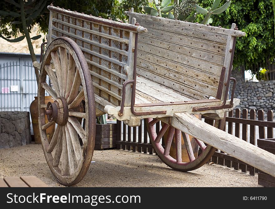 Antique wood cart with big wheels on park. Antique wood cart with big wheels on park
