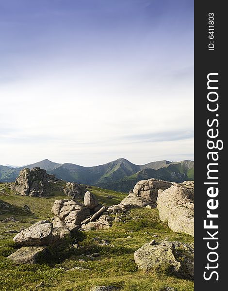 High mountain's rocks, summer, sky and clouds. High mountain's rocks, summer, sky and clouds