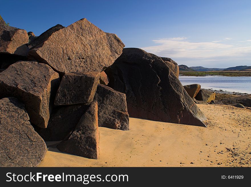 Seascape with rocks and clear sky. Barents sea. Seascape with rocks and clear sky. Barents sea.
