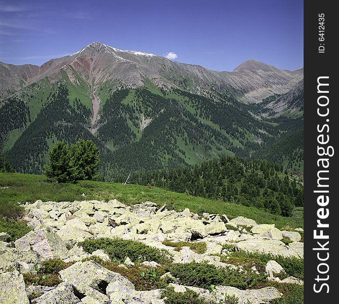 High mountain's rocks, summer, sky and clouds. High mountain's rocks, summer, sky and clouds