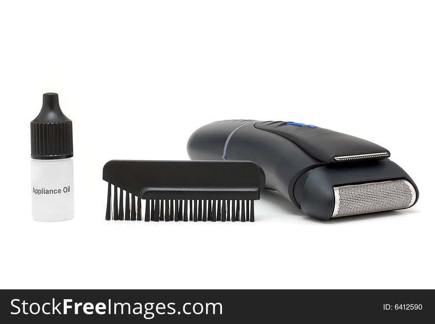 Electric shaver, oil and cleaning brush isolated. Electric shaver, oil and cleaning brush isolated