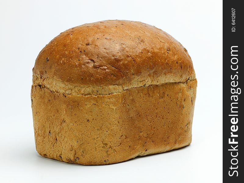 A loaf of brown bread on a white background