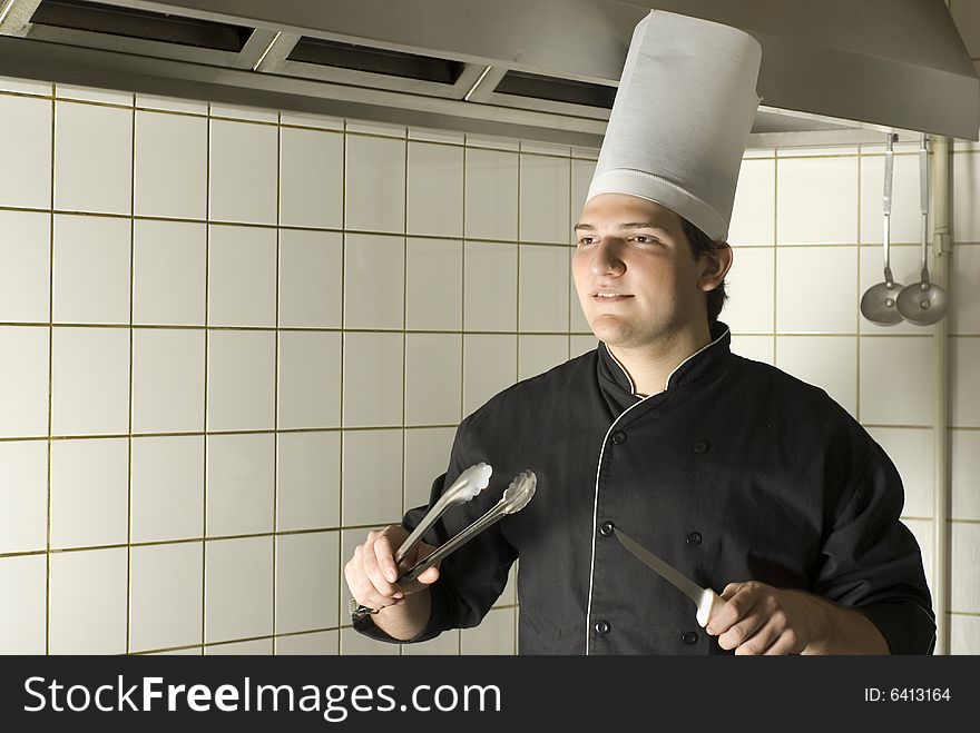 Chef Holding Utencils